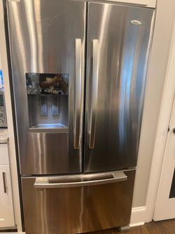 Whirlpool refrigerator and stove set