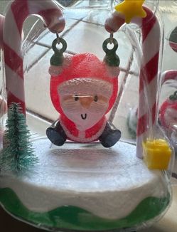 Set of 3 solar swinging Santas