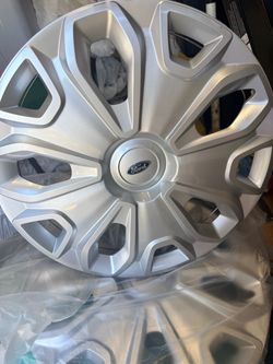 2 Ford hubcaps — NEW