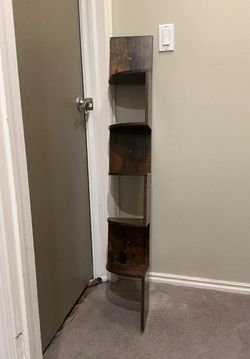 Floating shelf and black stool