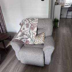Living Spaces Swivel Glider Recliner Chair