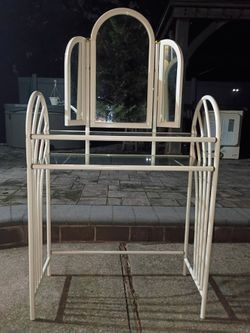 Clothing rack with mirror