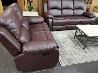 Brown leather reclining sofa and loveseat