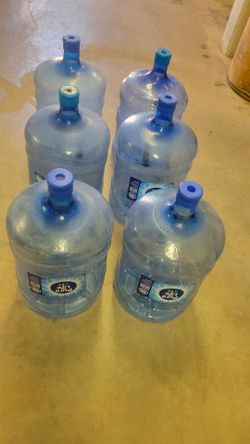 Six - 5 Gallon water jugs
