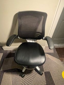 High-quality, heavy-duty office chair with a sturdy metal frame, breathable mesh back, comfortable padded seat, and smooth-rolling wheels. The chair