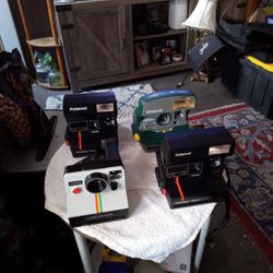 4 Polaroid Instant Cameras ( Sold Together).