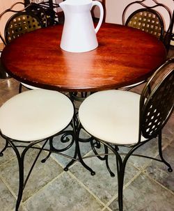 Solid Wrought Iron and walnut wood Bistro table w/4 WI padded chairs