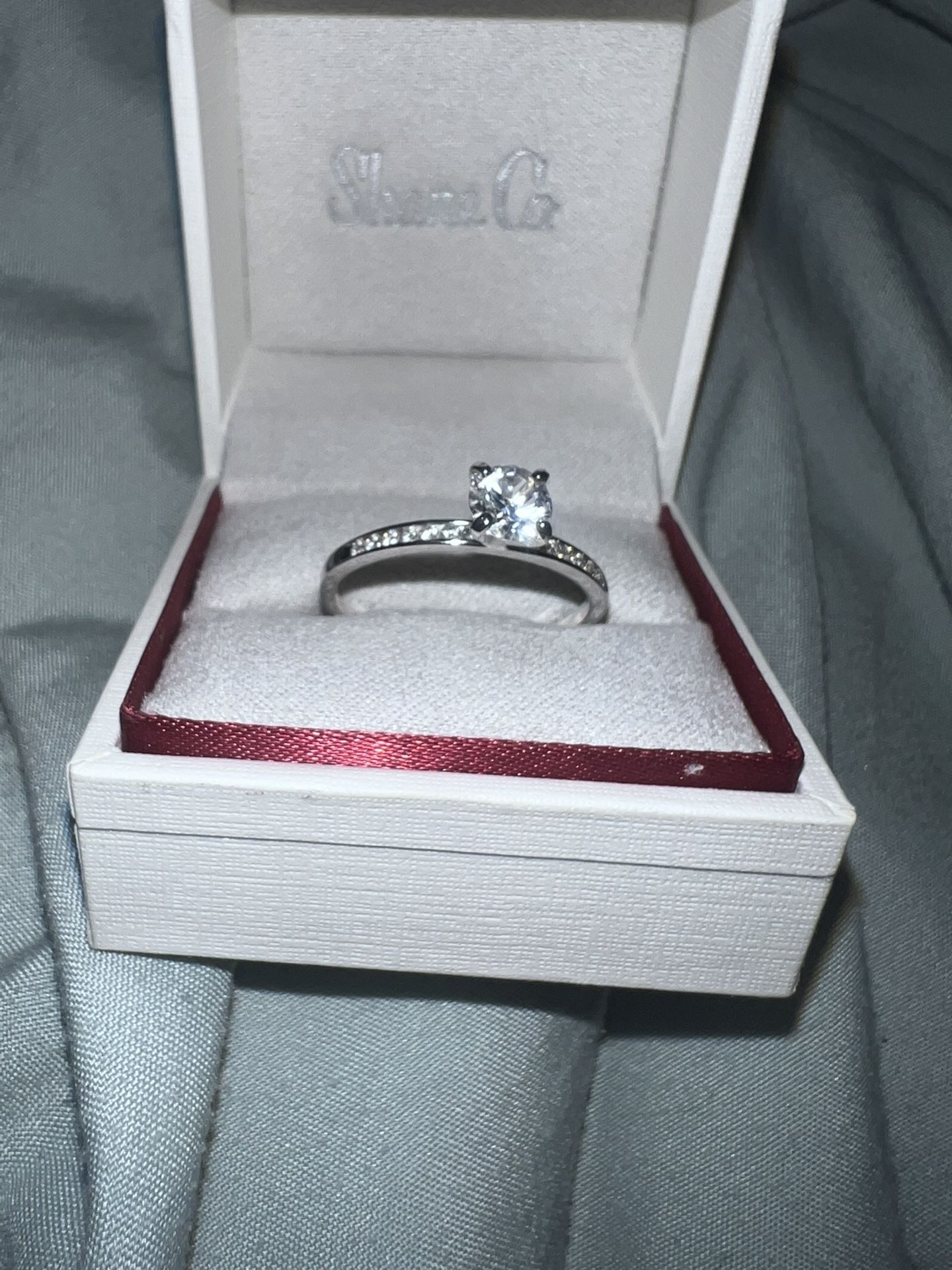 14k White Gold, Diamond, And White Safire Engagement ring.
