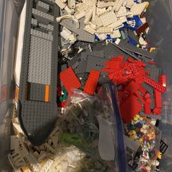 bin of lego plus few figures