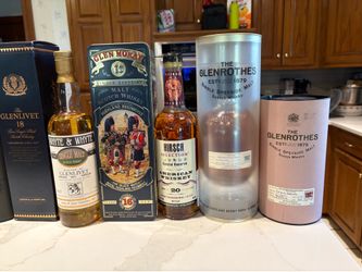 a WHISKEY BOTTLE COLLECTION unopened  1bottleis60yearsold