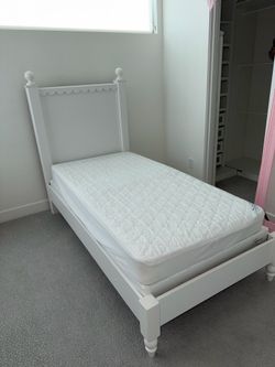 White Twin Bed with scalloped edge and  white desk and drawers set