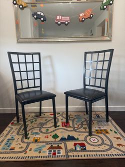 FOUR black dining chairs