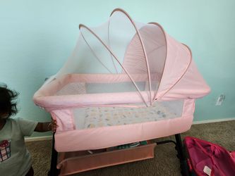 Pink Baby portable rocking Bassinet with Canopy and Storage Basket