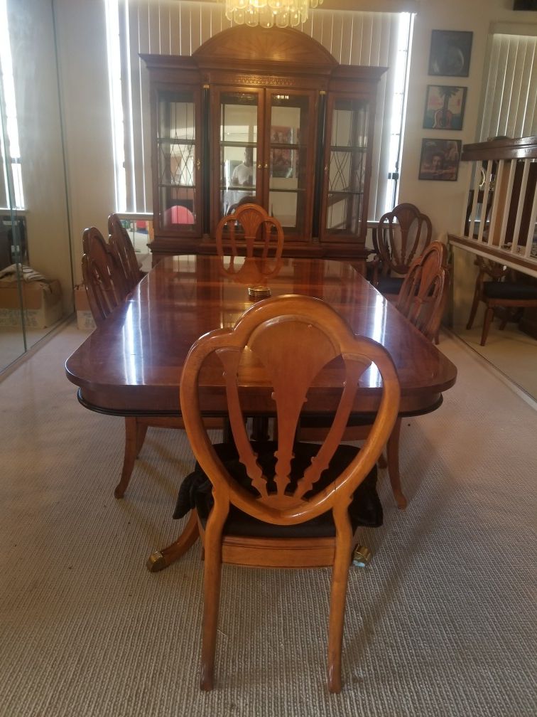 Formal dining set with six chairs and two leaves and matching China cabinet.
