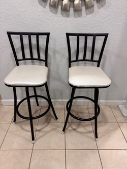 Two Bar Stools . height 28”.