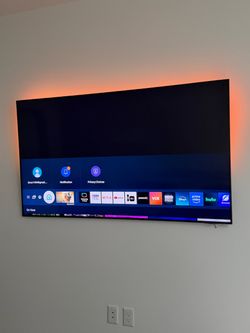 Samsung 70-inch QLED 4K Smart TV in excellent working condition.