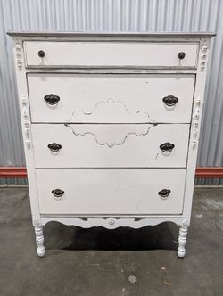 Distressed White Four-Drawer Chest with Carved Details