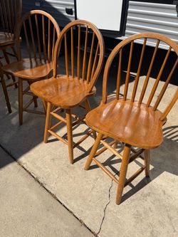 Wooden chairs that spin