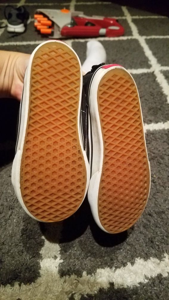 Black and white high top Vans