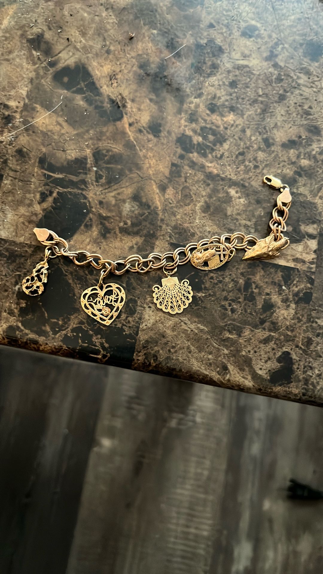 Italy 14k Gold With 5 14k Gold Charms On It