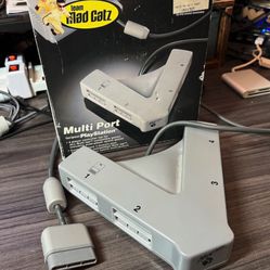 PS1 Playstation Multi-tap / multi-port 4-player adapter by Mad Catz.