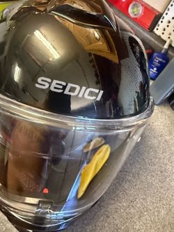 Motorcycle helmet with built in sun visor