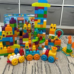 Multi mega bloks sets with train and sensory pieces