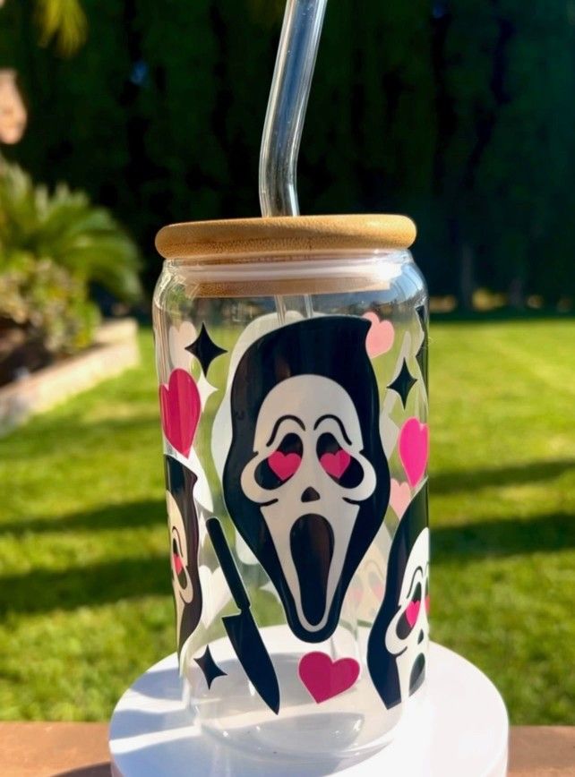 16 Oz glass cup with a bamboo lid and glass straw