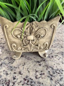Decorative planter with artificial plant