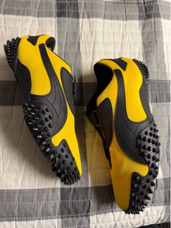 Brand New size 9.5 Black/Yellow Puma Mostro