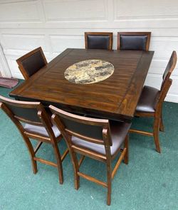 7-PC RICH BROWN FINISHED HIGH TOP DINING SET WITH LAZY SUSAN (TABLE AND 6 PADDED CHAIRS)