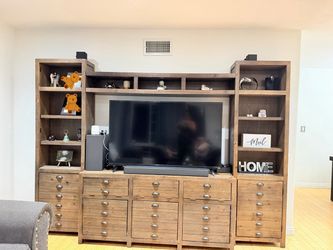 Oversized rustic wood entertainment center with tons of storage and display space