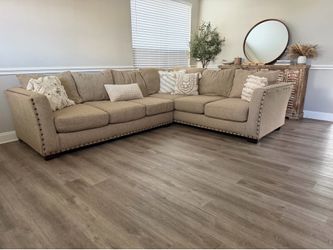 Beautiful beige studded sectional sofa