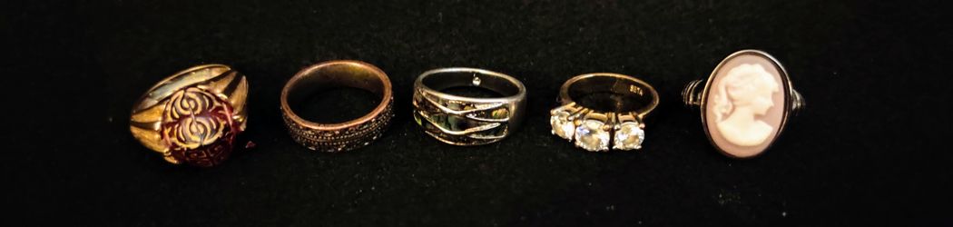 Lot of 5 Fashion Rings two of them stamped three rings size 7 one size 8