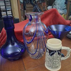 Assorted blue glassware, vases.
