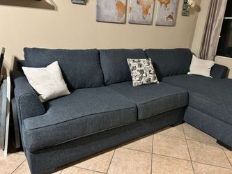 Beautiful Dark Blue sectional couch from Jerome’s