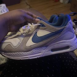 Nike Air Max SC in a white, grey, and royal blue colorway. 