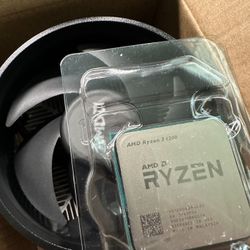Lightly used Ryzen 3 1200 AMD4 CPU with new unused Wraith Cooler