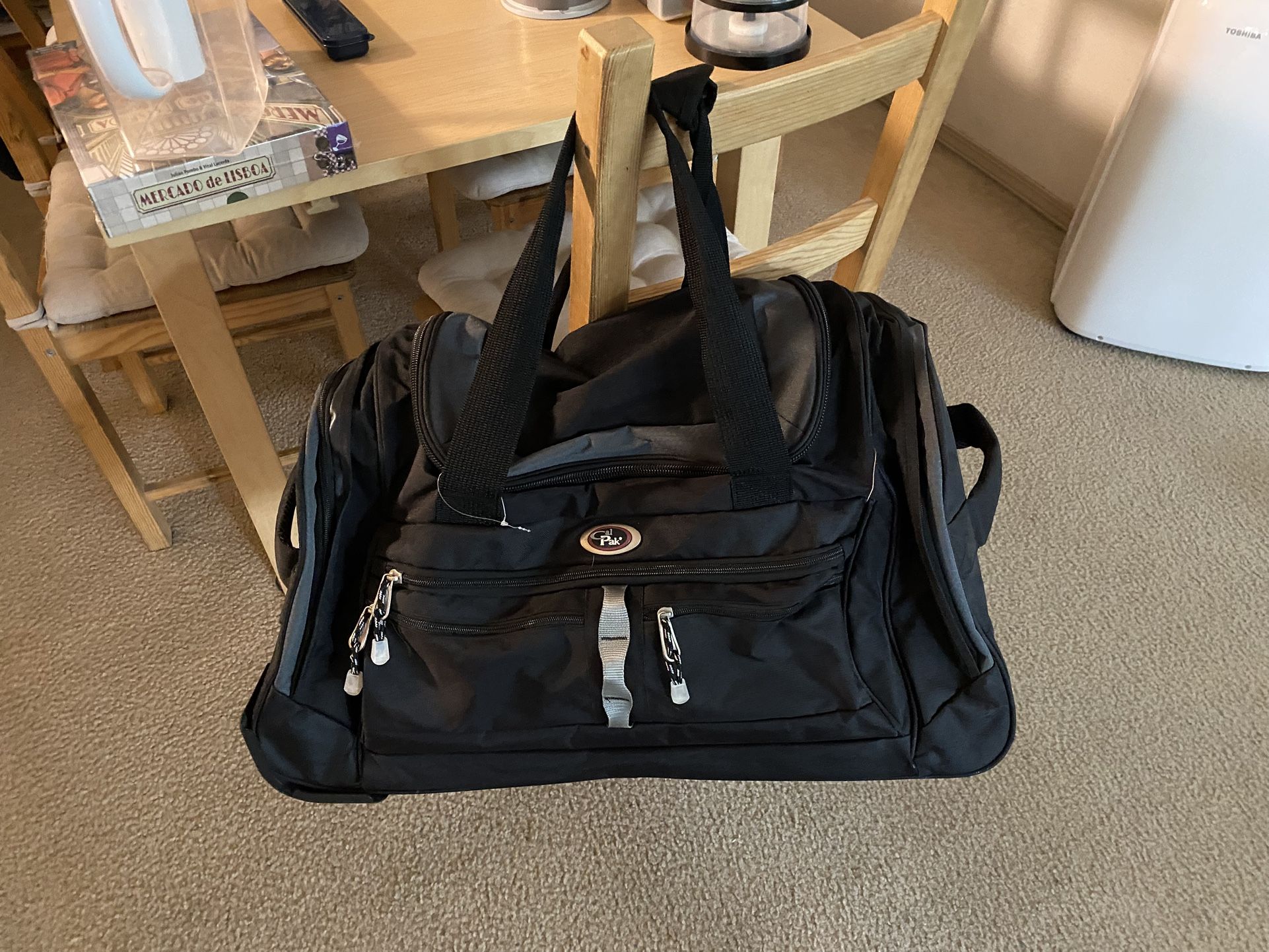 CALPAK travel bag with wheels and telescopic handle
