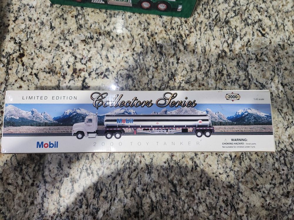 Mobil Collection Trucks. Never Opened 