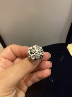 Ring with black and white design and lots of diamonds