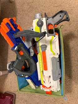Random assortment of nerf guns and accessories plus some darts