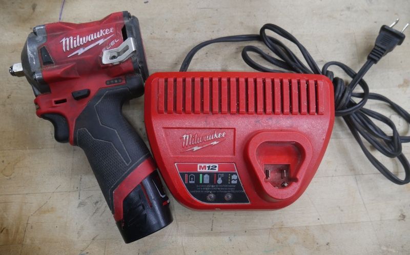   Milwaukee 2554-20 M12 FUEL Stubby 3/8" Impact Wrench Kit , battery 1.5 AH, 48-59-2401 . used. tested. in a good working order. 