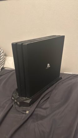 PS4 with charging stand and controller