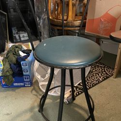 Two stools a book magazine rack metal