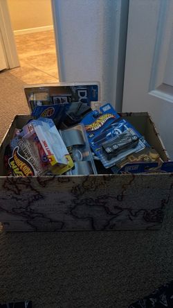 A box of random old, dead stock toy cars