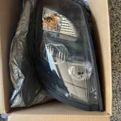 Volvo Headlight (OEM) – New in Box