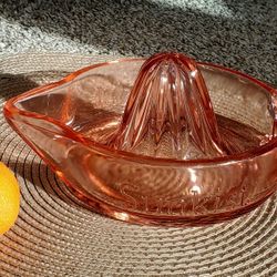 Pink depression glass Sunkist citrus reamer.