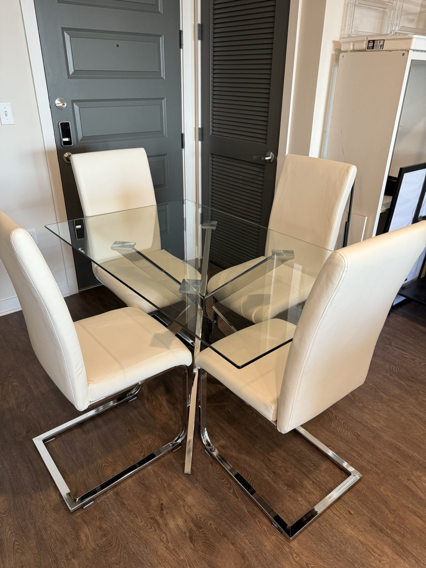 Glass Dining Table with Chrome Base + 4 White Faux Leather Chairs Like New
