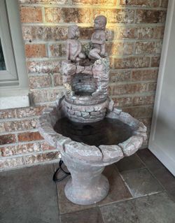 Vintage concrete water fountain waterfall